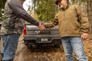 LandGuys Managing Broker of Wisconsin Luke Wessel shaking hands with a rural land client